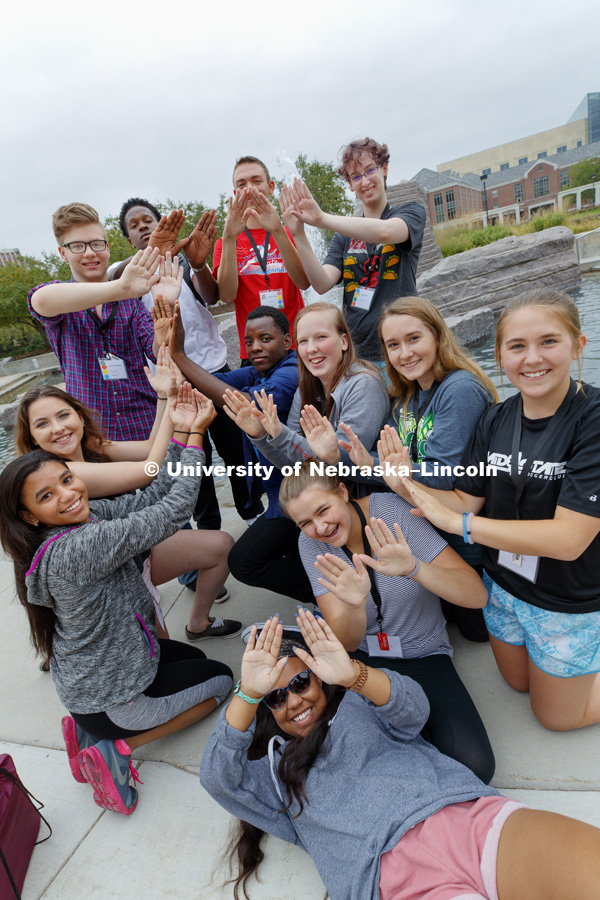 First Husker Program students form the letter "S" with their hands during the Photo Scavenger Hunt. Students spell out letters of the word "Husker" at various landmarks and student service locations. August 15, 2017. Photo by Craig Chandler / University