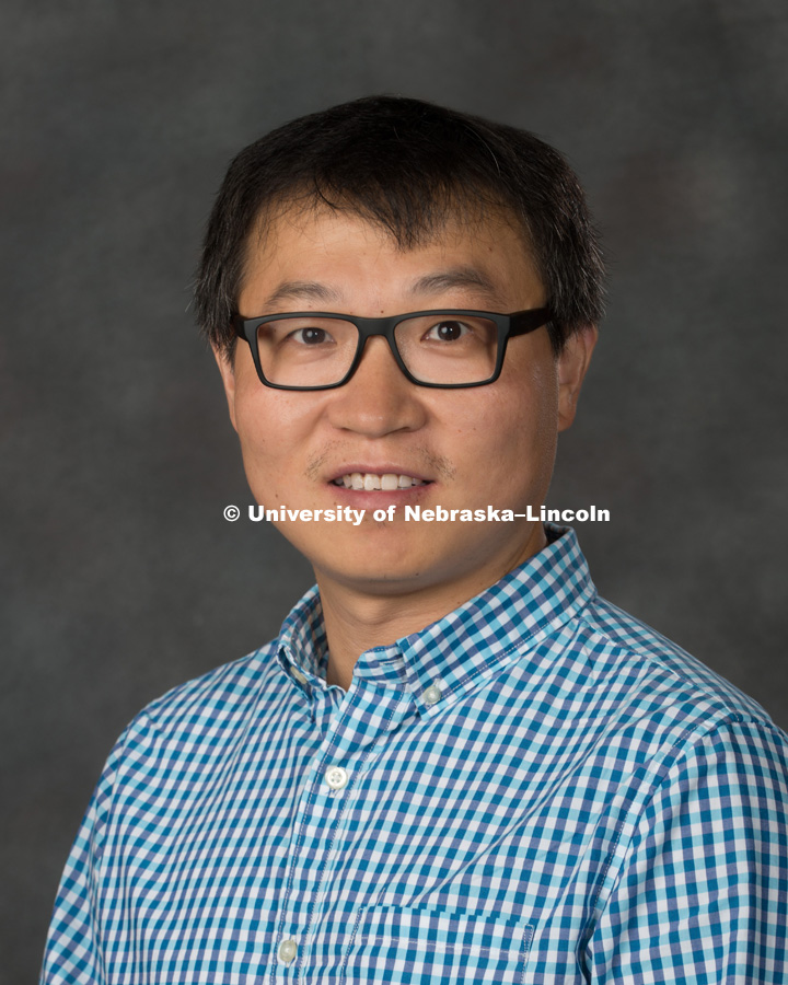 Studio portrait of Jinliang Yang, Assistant Professor, Agronomy and Horticulture. New Faculty Orientation. August 16, 2017. Photo by Greg Nathan, University Communication Photography.