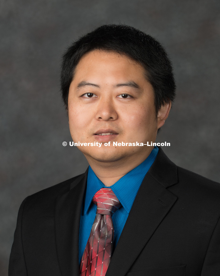 Studio portrait of Shengchao Zhuang, Assistant Professor of Finance, College of Business. New Faculty Orientation. August 16, 2017. Photo by Greg Nathan, University Communication Photography.
