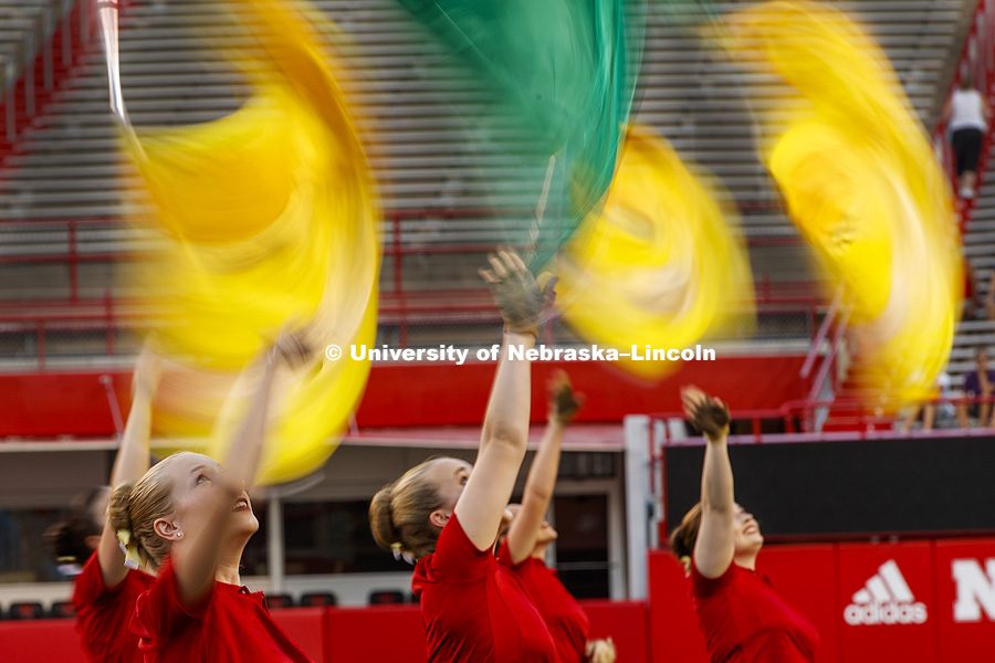 Flags swirl as Brooke Harmon and the rest of flag line perform during The Cornhusker Marching Band's annual exhibition performance at Memorial Stadium. August 18, 2017. Photo by Craig Chandler / University Communication.