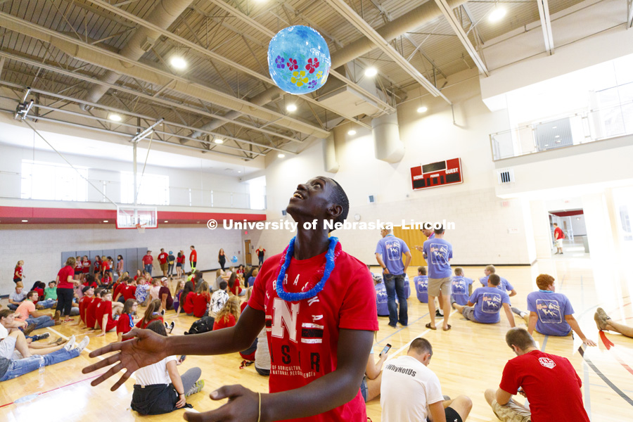 Luc Arnaud Igena, a freshman from Rwanda, makes a soccer pass with a beach ball using his head at the CASNR Luau at East Campus Rec Center.  August 18, 2017. Photo by Craig Chandler / University Communication.