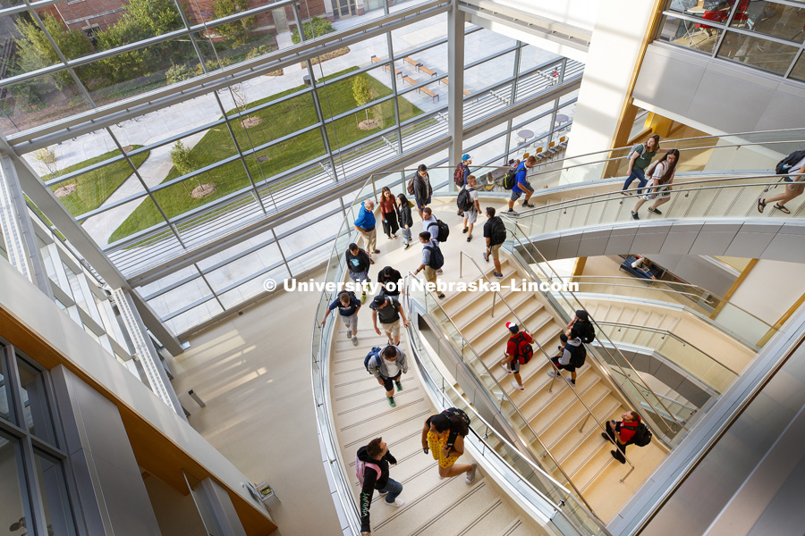 Students walk up the south staircase toward the third floor of the College of Business' new Howard L. Hawks Hall. August 21, 2017. Photo by Craig Chandler / University Communication.