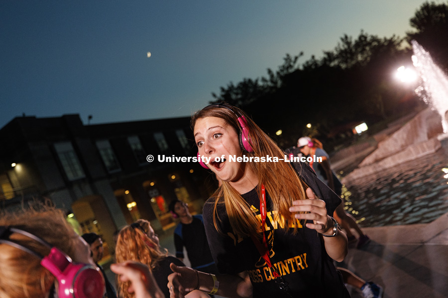 Grace Fawcett dances during the headphone disco party at the Back to School Bash on the Nebraska Union Plaza and Green Space sponsored by Campus NightLife. Students enjoyed a headphone disco party, inflatable games, and refreshments. August 25, 2017.