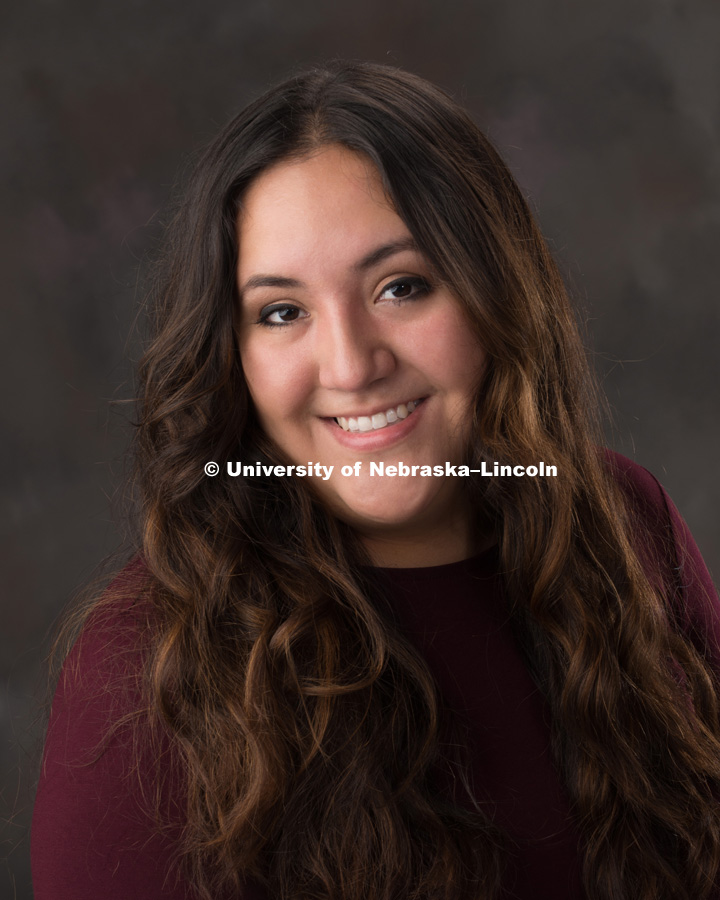 Studio portrait of Sarita Garcia, Graduate Research Assistant for the Center for Digital Research in the Humanities. September 8, 2017. Photo by Greg Nathan, University Communication Photography.