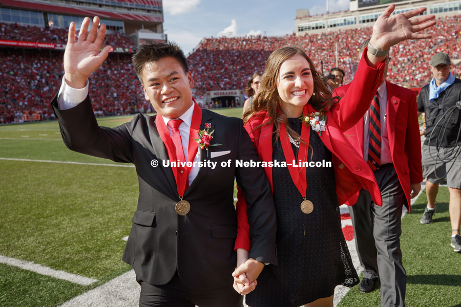 Shayne Arriola and Laura Springer walk off the field after being named homecoming king and queen. It was a memorable day for University of Nebraska-Lincoln seniors Shayne Arriola and Laura Springer, both of Grand Island. First, they became homecoming king