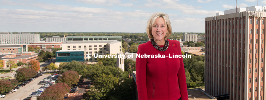 Donde Plowman, Executive Vice Chancellor and Chief Academic Officer, Academic Affairs, standing on top of a building with the University of Nebraska – Lincoln City Campus in the background. October 10, 2017. Photo by Greg Nathan, University Communication.