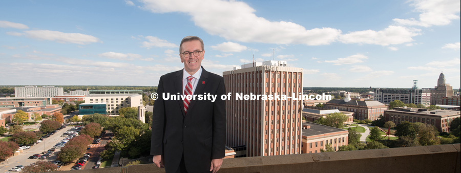 Chancellor Ronnie Green, standing on top of a building with the University of Nebraska – Lincoln City Campus in the background. October 10, 2017. Photo by Greg Nathan, University Communication.