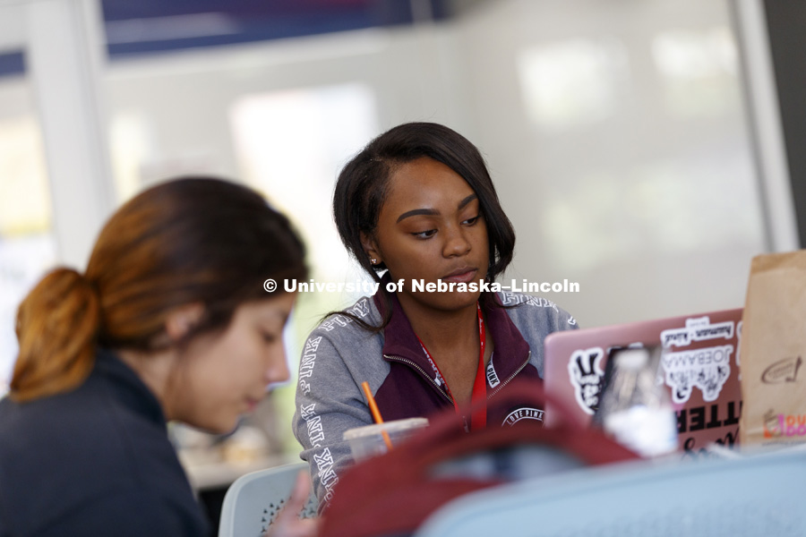 Kyla Collins works on Biology homework with her friend, Lis Flores, in Love Library's Adele Coryell Hall Learning Commons. City Campus fall day. October 25, 2017. Photo by Craig Chandler / University Communication.