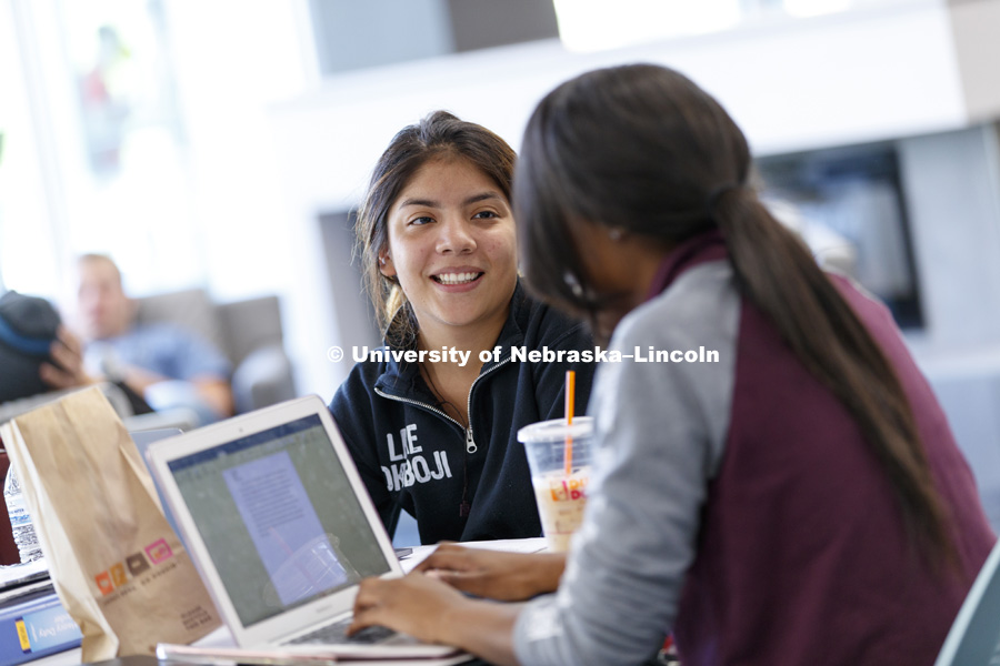 Lis Flores works on Biology homework with her friend, Kyla Collins, in Love Library's Adele Coryell Hall Learning Commons. City Campus fall day. October 25, 2017. Photo by Craig Chandler / University Communication.