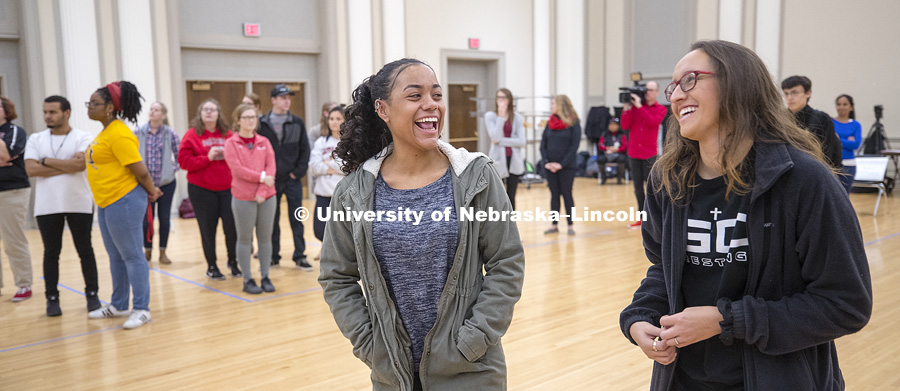 Corina Marsh and Savannah Clover laugh as they find themselves in the middle of the ballroom. Huskers meet in the Union Ballroom for the UnBoxing exercise. Participants began by standing in boxes by self-defined opposite attributes such as Big City/Small