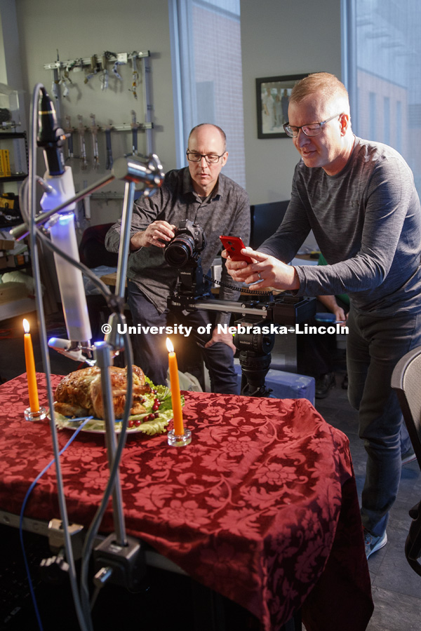 Dave Fitzgibbon of University Communication, and Shane Farritor and his assistant set up the "turkey" and the robot for the photo shoot. Turkey (actually a chicken) is being carved by a robotic surgery device at Virtual Incision, a start up by Nebraska
