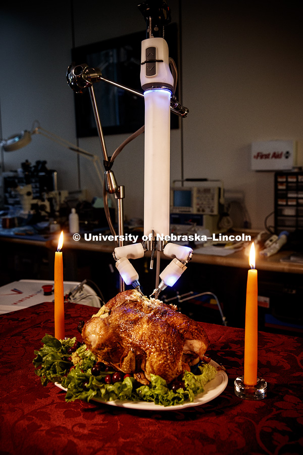 Turkey (actually a chicken) is being carved by a robotic surgery device at Virtual Incision, a start up by Nebraska professor Shane Farritor. Photo shoot is used to promote research and tie into the Thanksgiving holiday. November 14, 2017. Photo by Craig