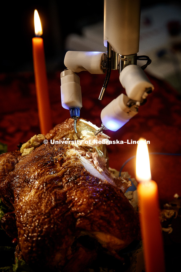 Turkey (actually a chicken) is being carved by a robotic surgery device at Virtual Incision, a start up by Nebraska professor Shane Farritor. Photo shoot is used to promote research and tie into the Thanksgiving holiday. November 14, 2017. Photo by Craig