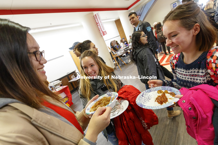Linh Phung, left, Miren Chacon and Ane Chacon compare dishes at the International Food Bazaar. The International Food Bazaar showcases cuisines from all over the world. Registered student organizations representing a variety of countries and cultures will