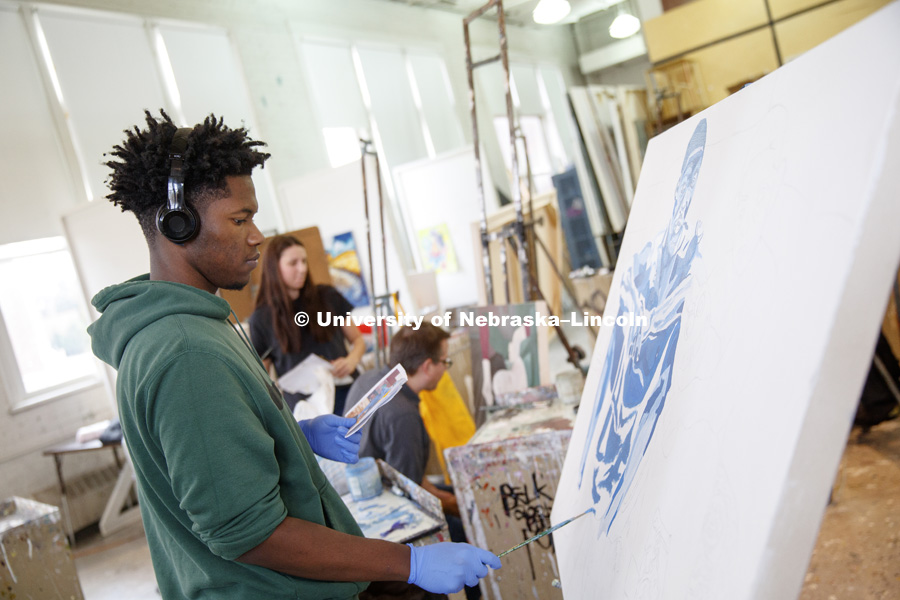 Samuel McGee, a sophomore from Omaha, works on his painting. Aaron Holz beginning painting class works on final projects in Richards Hall. The students learn brush strokes and technique by copying a master work of art. PANT 251 - Beginning Painting I.