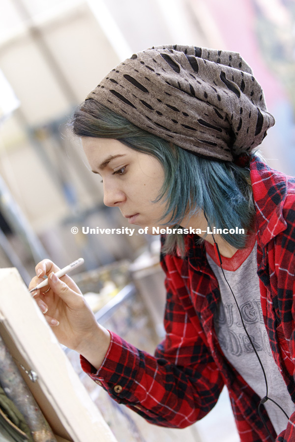 Taylor Blanchard, a sophomore from Lincoln, works on her painting. Aaron Holz beginning painting class works on final projects in Richards Hall. The students learn brush strokes and technique by copying a master work of art. PANT 251 - Beginning Painting