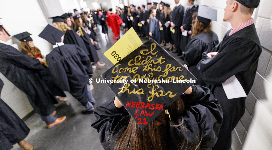 Madaline Branstetter decorated her mortar board with her next goal. Undergraduate Commencement at Pinnacle Bank Arena. December 16, 2017. Photo by Craig Chandler / University Communication.