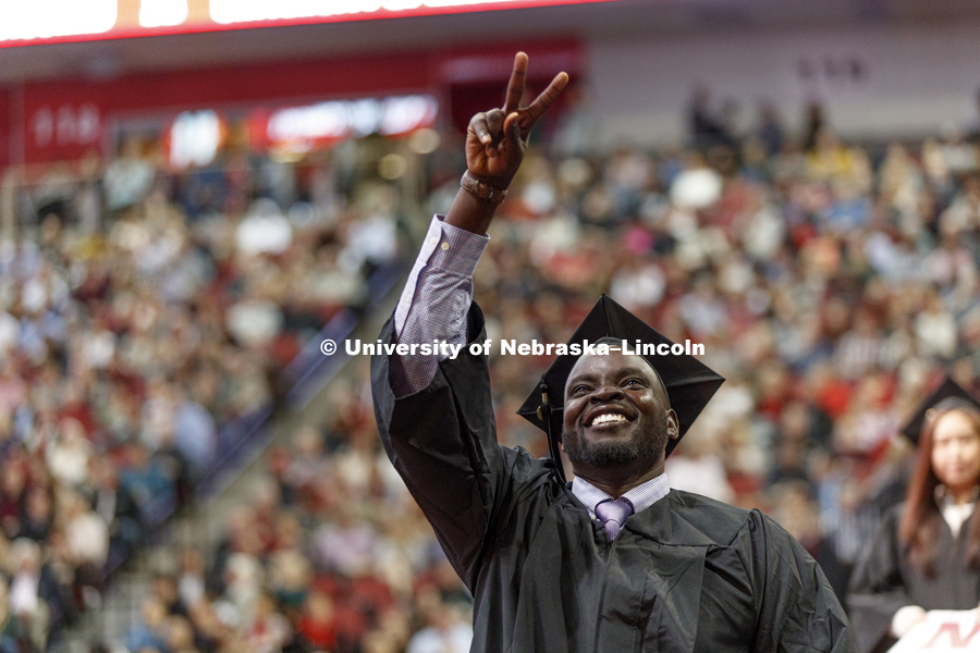 John Wiyual celebrates his College of Business degree. Undergraduate Commencement at Pinnacle Bank Arena. December 16, 2017. Photo by Craig Chandler / University Communication.