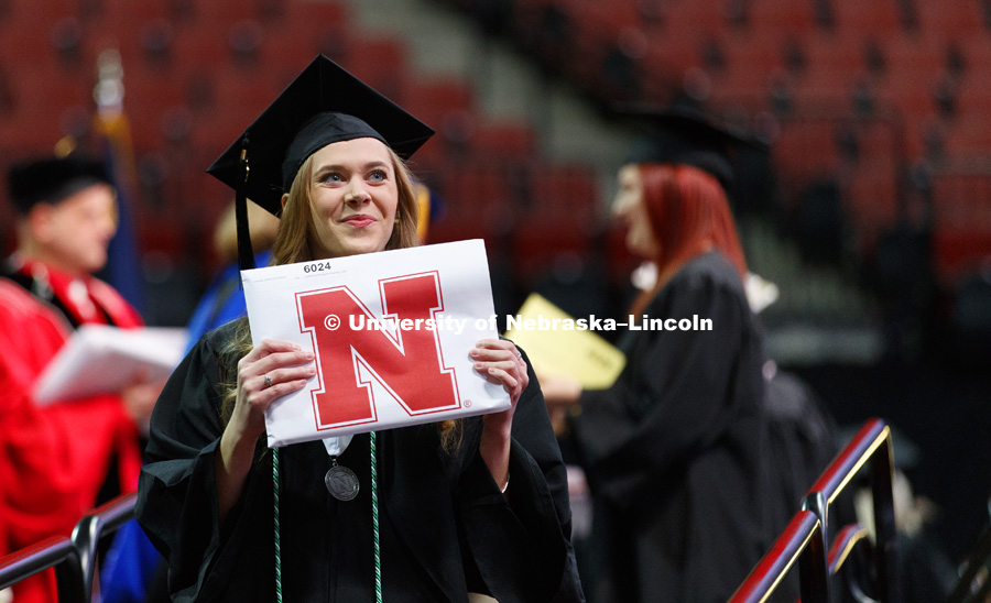 Catherine Doering shows off her CEHS diploma. Undergraduate Commencement at Pinnacle Bank Arena. December 16, 2017. Photo by Craig Chandler / University Communication.