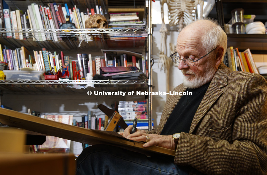 Bob Hall works in his basement studio. Hall, comic book artist and artist for Virus Comic Books and a UNL alumni. January 18, 2018. Photo by Craig Chandler / University Communication.