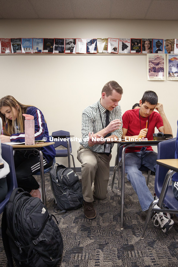 Braedon Root works with his Economics students while student teaching at Northstar High School. February 15, 2019. Photo by Craig Chandler / University Communication.