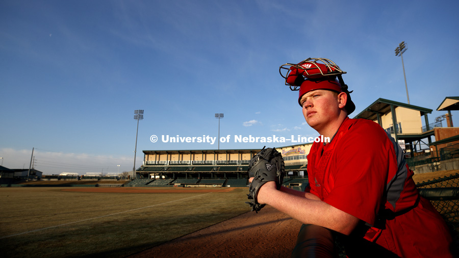 Kendrick Umphreys, a freshman in nutrition and health sciences and a first generation student, is continuing his love of baseball at Nebraska by working as the bullpen warm-up catcher for the Husker baseball team. March 9, 2018. Photo by Craig Chandler /
