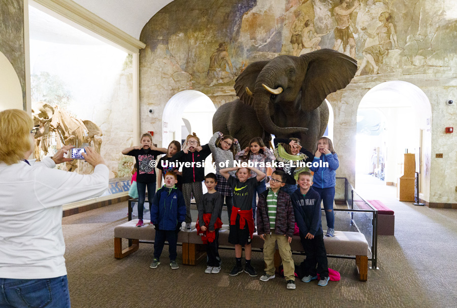 Students from a Gretna elementary school pose for a photo with their teacher during a field trip to the museum. March 22, 2018. Photo by Craig Chandler / University Communication.