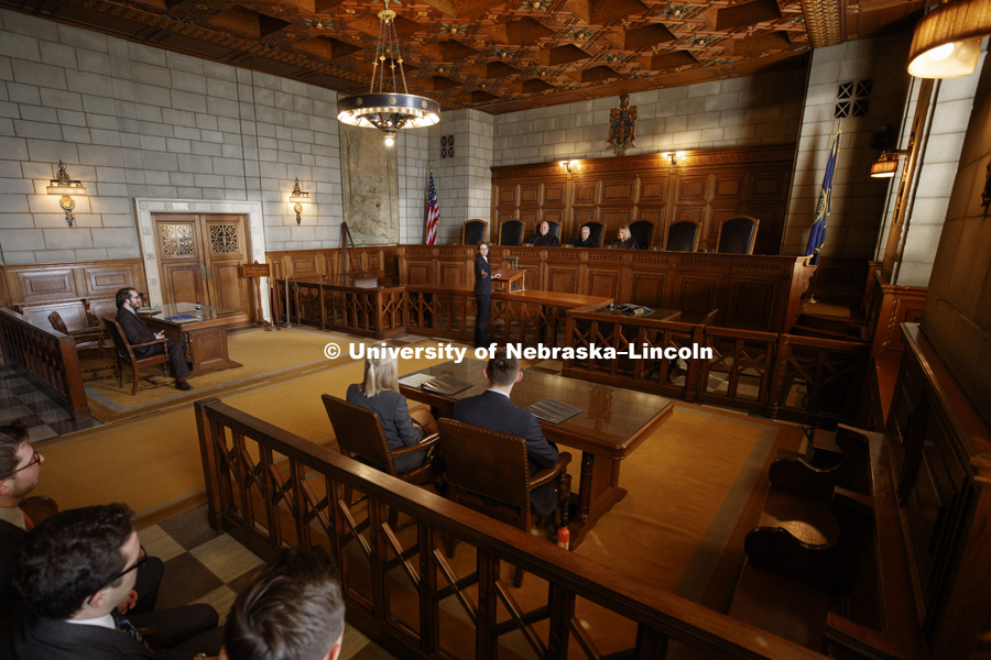 Maureen Larsen, ’19 makes a point before Nebraska Supreme Court Justices Hon. William B. Cassel, ’77, ’79, Hon. Michael G. Heavican, ’75, Hon. Stephanie F. Stacy, ‘91 during the 2018 Thomas Stinson Allen Moot Court Competition. Justices of the Nebraska