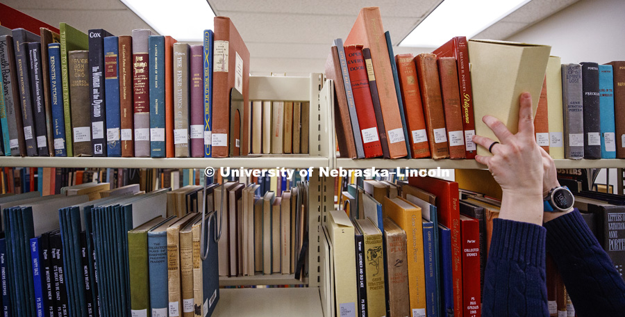The basement of Love Library north filled with hunters looking to document interesting bits of history in handwritten margin notes, photographs and other objects. Crowd-sourced digital humanities project, Book Traces. The event was led by Peter Capuano,