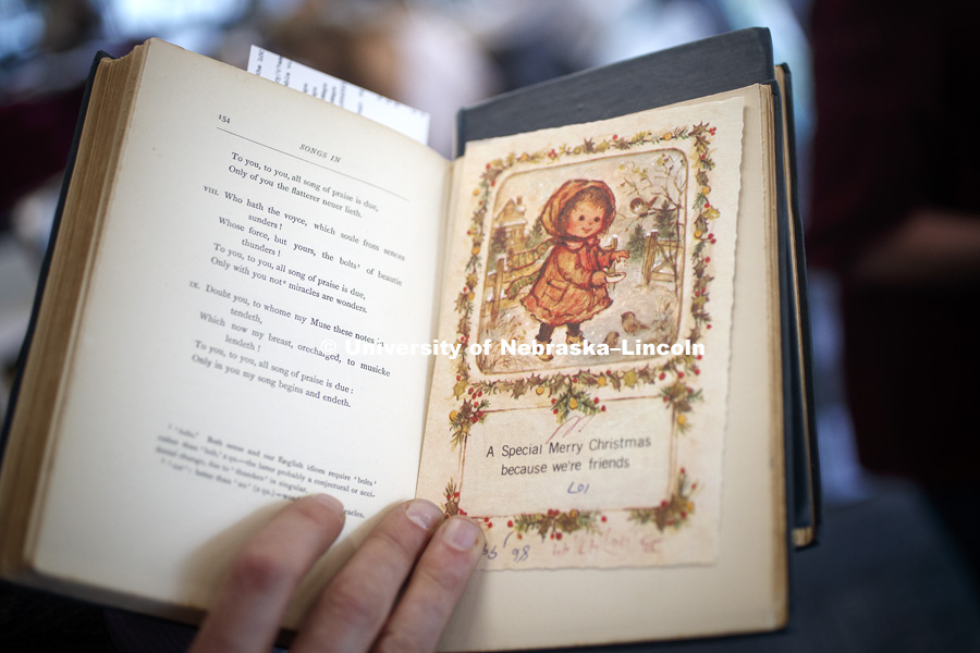 An early 1900s Christmas card was used as a bookmark and left behind in a book. The basement of Love Library north filled with hunters looking to document interesting bits of history in handwritten margin notes, photographs and other objects. Crowd