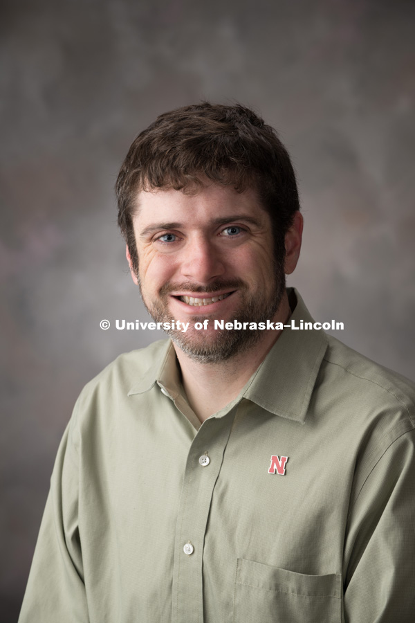 Studio portrait of Brian Bockelman, Research Assistant Professor, Computer Science and Engineering. April 6, 2018. Photo by Greg Nathan, University Communication Photography.