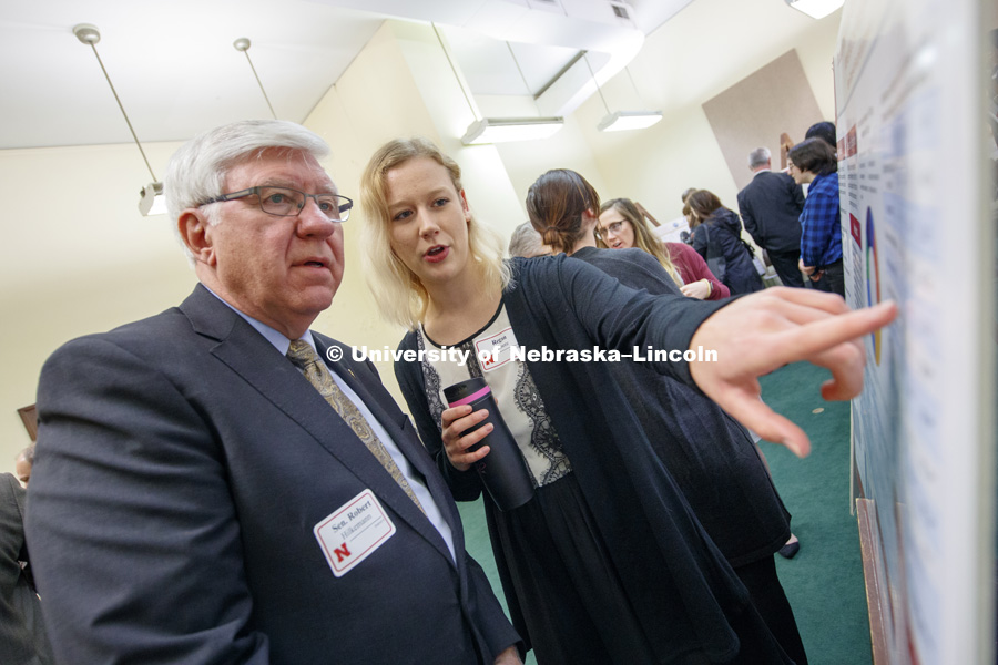 Regan Gilmore explains her research on Statistical Analysis of Agriculture Conservation Practices to Senator Robert Hilkemann. State Senators Research Fair at the Capitol. April 10, 2018. Photo by Craig Chandler / University Communication.