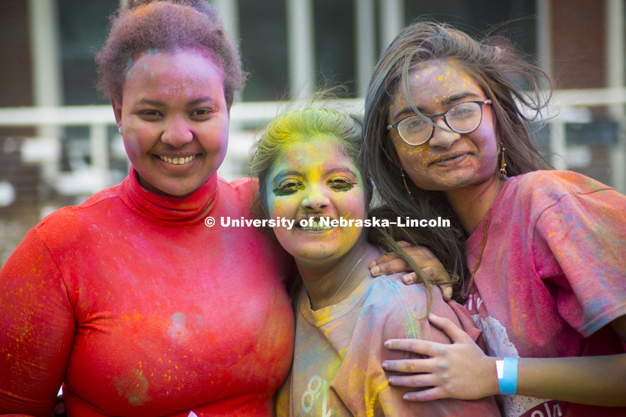 Students celebrate Holi, the Indian festival of spring, colors and celebration. Students tossed colored corn starch into the air and onto each other on the Selleck volleyball courts. April 15, 2018. Photo by Alyssa Mae for University Communication.