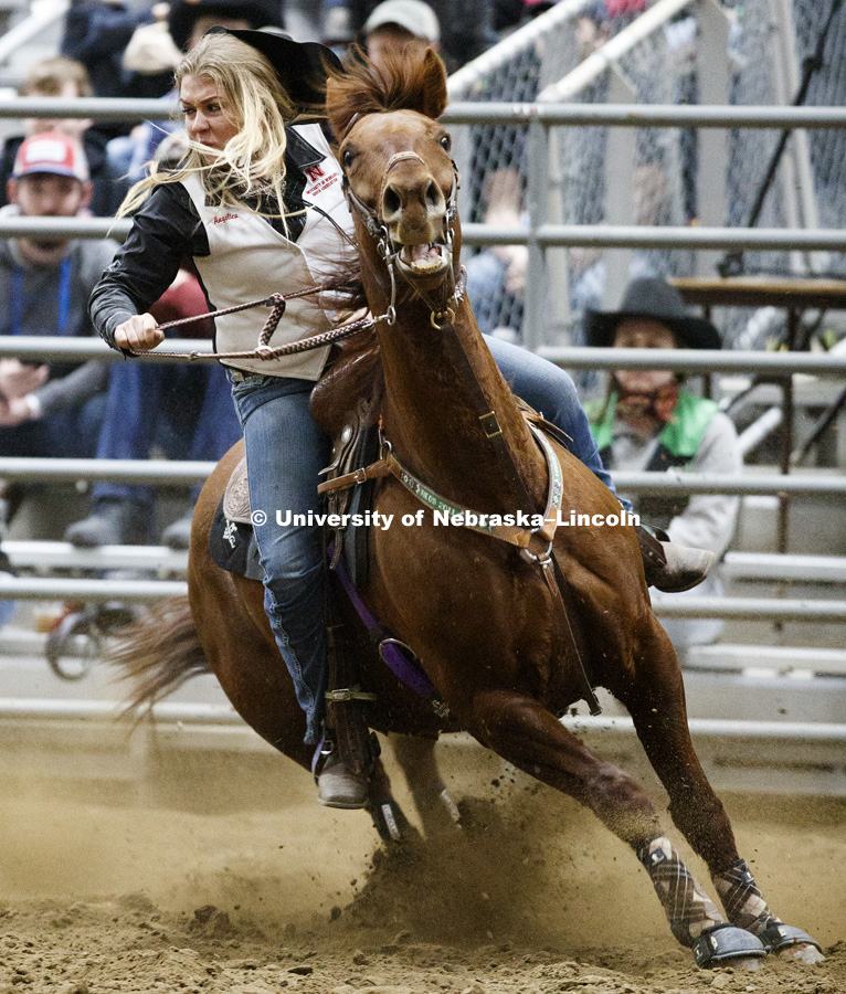 Angelica Wellman rounds a barrel during the barrel racing event. 60th anniversary of the University of Nebraska-Lincoln Rodeo Club. April 20, 2018. Photo by Craig Chandler / University Communication.