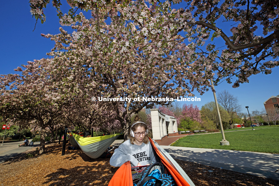 Elizabeth Schmitz of Dilworth, MN, relaxes after finishing her last final as she sits in the hammock outside the Nebraska Union. May 4, 2018. Photo by Craig Chandler / University Communication.