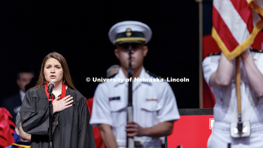 Emily Freeman, a soon-to-graduate bachelor of music education, sings the national anthem. Undergraduate Commencement at Pinnacle Bank Arena. May 5, 2018. Photo by Craig Chandler / University Communication.