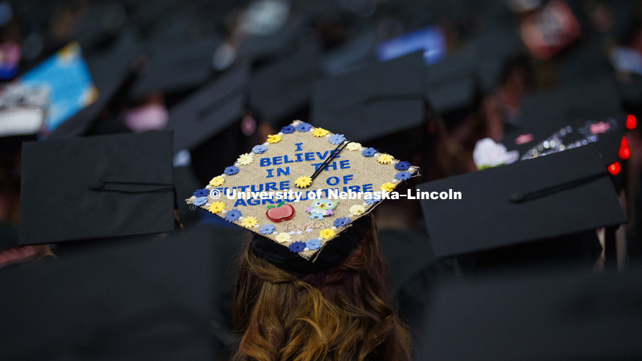 Morgan Fangmeier wears her pride in agriculture on her mortarboard. Undergraduate Commencement at Pinnacle Bank Arena. May 5, 2018. Photo by Craig Chandler / University Communication.