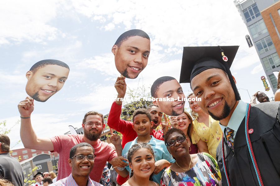 Preston Barrett and his fan club of family and friends pose for a photo outside Pinnacle Bank Arena. Undergraduate Commencement at Pinnacle Bank Arena. May 5, 2018. Photo by Craig Chandler / University Communication.