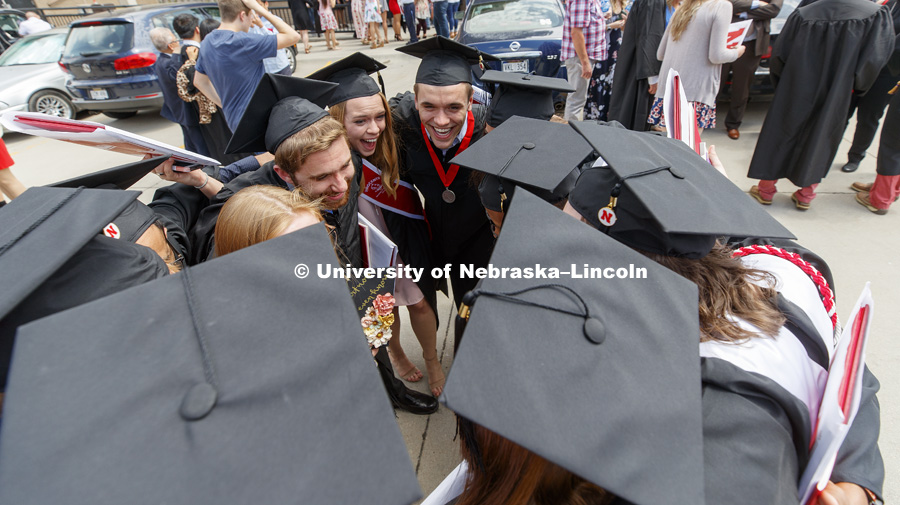 A group of Chemical Engineering graduates celebrate one last time being together after commencement. Undergraduate Commencement at Pinnacle Bank Arena. May 5, 2018. Photo by Craig Chandler / University Communication.