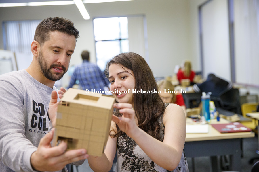 Chris Antonopoulos and Karolayn Chavez Loor discuss the structural openings and angles on Loor's model. Students work on concept models in DSGN 111 - Design Making. June 4, 2018. Photo by Craig Chandler / University Communication.