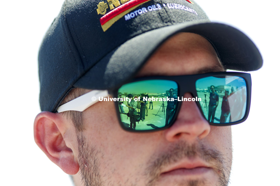 The media is reflected in the sunglasses of NASCAR Xfinity Series driver Michael Annett during the tour. Test of bull-nose barrier for use in medians to protect cars from overpass columns. Test was at university's Midwest Roadside Safety Facility at the