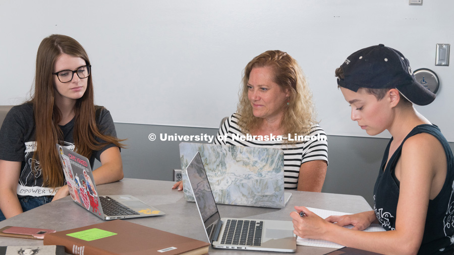 Huskers help create George Eliot digital archive. (From left) Rachel Gordon, Beverley Rilett and Megan Ekstrom discuss the George Eliot Archive during a meeting June 15, 2018, in the Adele Hall Learning Commons at Love Library. Not picture is team member