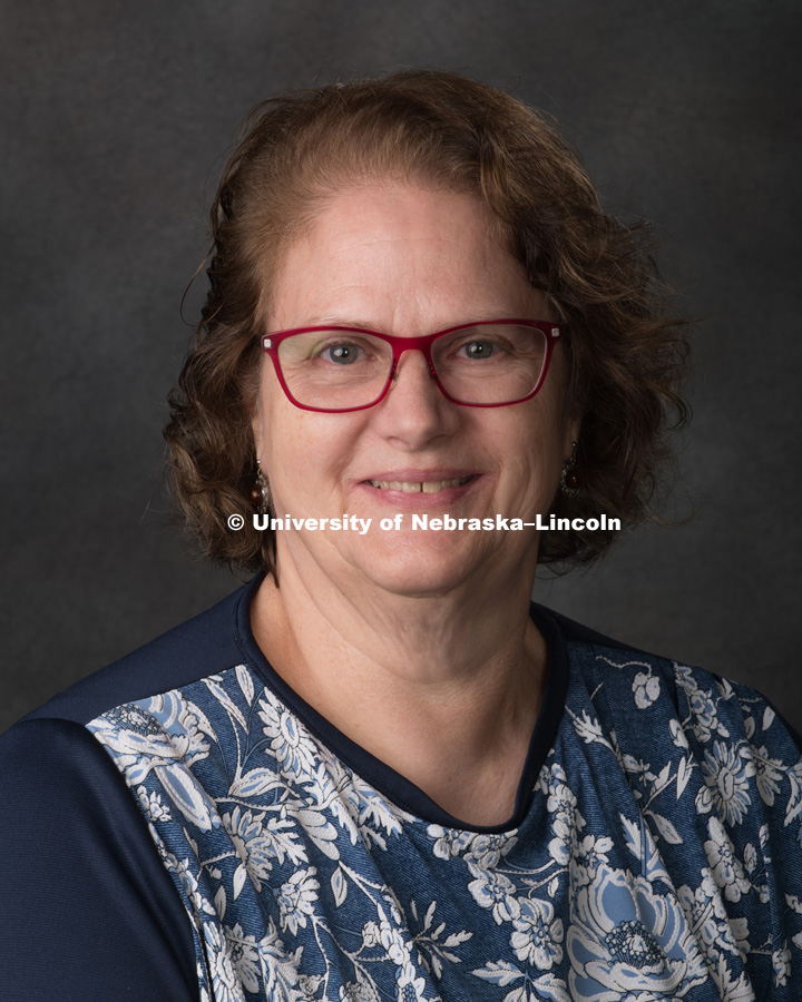 Studio portrait of Anne Embree, Central Administration. August 10, 2018. Photo by Greg Nathan, University Communication Photographer.