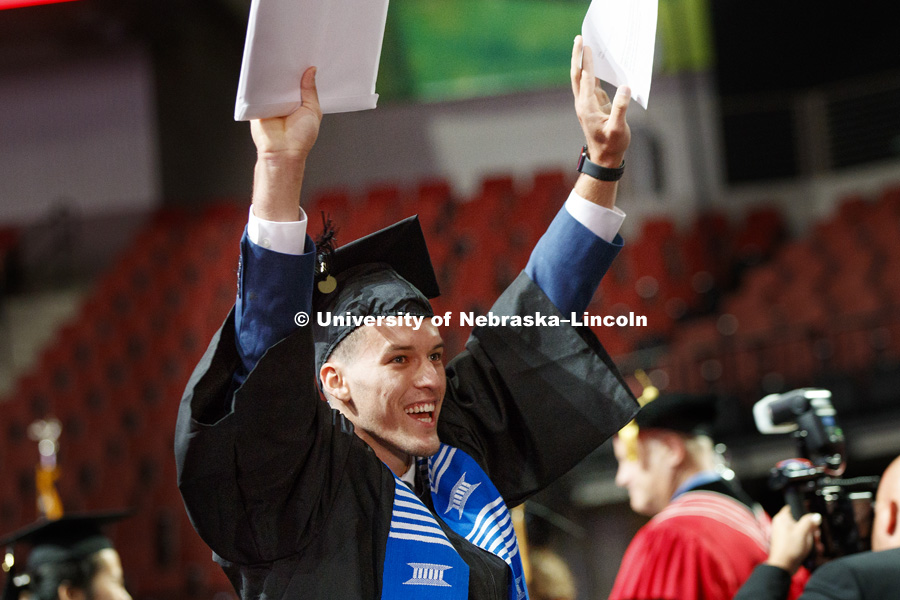 Daniel Leal celebrates the glory of his graduation and College of Business diploma. Summer Commencement at Pinnacle Bank Arena. August 11, 2018. Photo by Craig Chandler / University Communication.