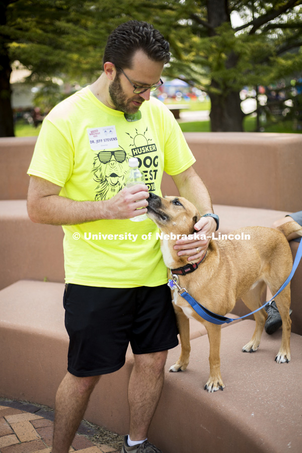 Jeffery Stevens greets the family dog, Koda, during the Husker Dog fest on August 11, 2018 on the University of Nebraska-Lincoln Campus. Photo by Alyssa Mae for University Communication.