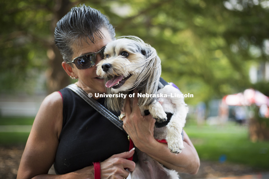 Amy cuddles her dog, Winston, during the Husker Dog fest on August 11, 2018 on the University of Nebraska-Lincoln Campus. Photo by Alyssa Mae for University Communication.