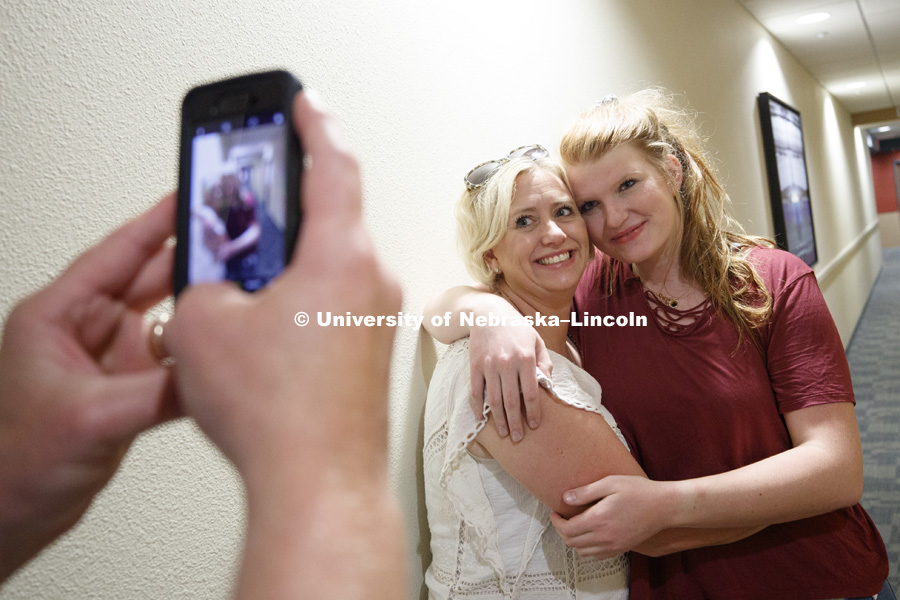 Grace Partridge of Rapid City, South Dakota, poses with her mom, Katrina, after moving into University Suites. Housing move in for sorority rush week. August 12, 2018. Photo by Craig Chandler / University Communication.
