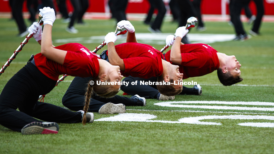 The drum majors take a bow before the start of the Cornhusker Marching Band Exhibition. August 17, 2018. Photo by Craig Chandler / University Communication.