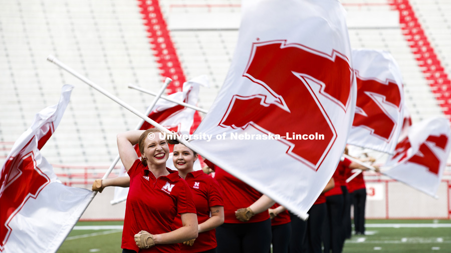 All red and white as the Color Guard marches during the Cornhusker Marching Band Exhibition. August 17, 2018. Photo by Craig Chandler / University Communication.