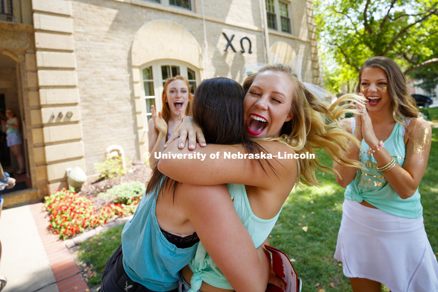Hugs for a new sister at Chi Omega. Bid Day for Greek Sororities. August 18, 2018. Photo by Craig Chandler / University Communication.